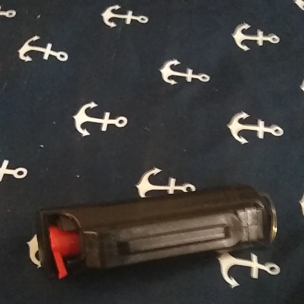 Black Pepper Spray with Red Trigger